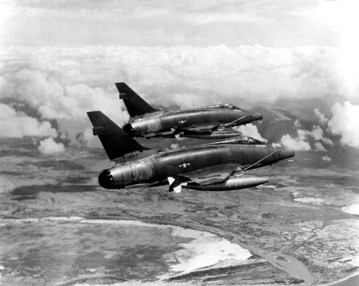 AN air-to-air right rear view of two F-100D Super Sabre… — NARA