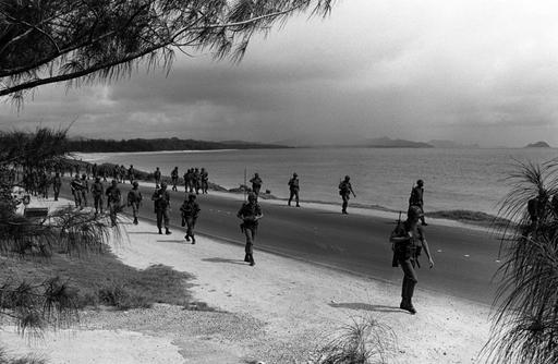 Soldiers from Schofield Barracks pass a beach during their road march ...
