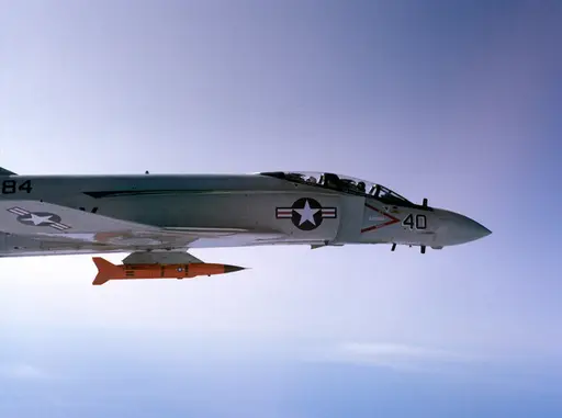 A left side view of an F-4 Phantom II aircraft with… — NARA and
