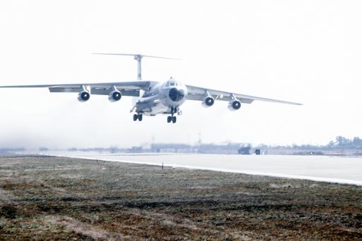 A ground-to-air front view of a C-141B Starlifter aircraft coming in ...
