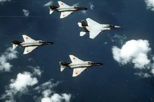 JASDF Fighting Wings Photo CD 航空自衛隊 An air-to-air left side view of two Japanese Air Self… — NARA and