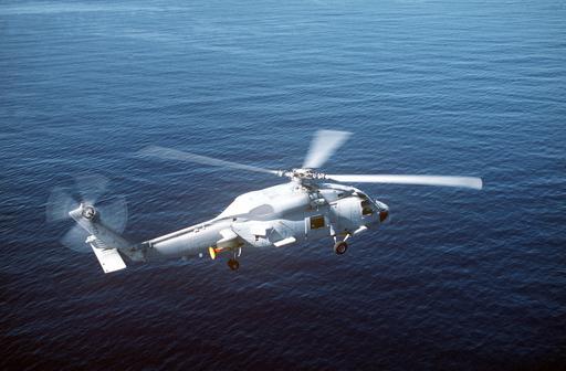 Air-to-air right side view of a Navy SH-60B Seahawk helicopter from ...