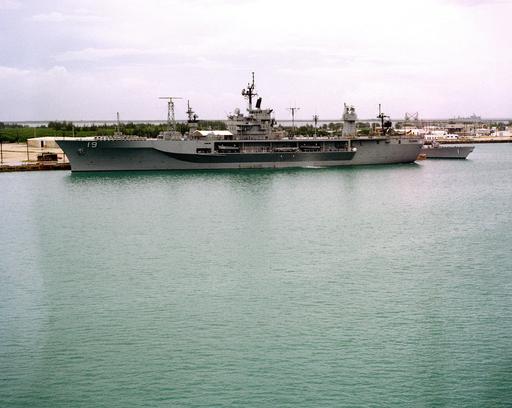 A port beam view of the amphibious command ship USS BLUE… — NARA
