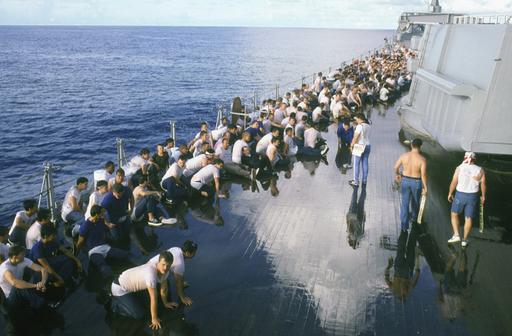 Crew members aboard the battleship USS MISSOURI (BB 63) participate in ...