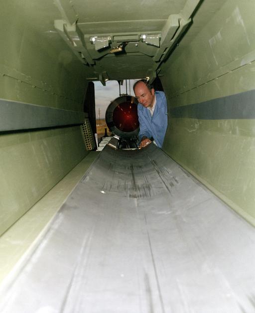 A technician demonstrates a phase of the loading procedure for the Army ...