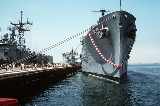 The repair ship USS JASON (AR-8) lies tied up at the pier