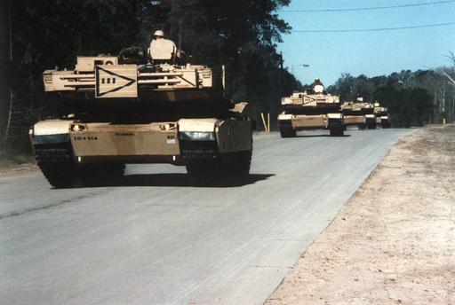 M-1 Abrams Tanks convoy towards the rail marshaling area during SEDRE ...