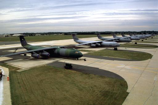 A row of USAF C-141 Starlifter aircraft from the 305TH and… — NARA and ...
