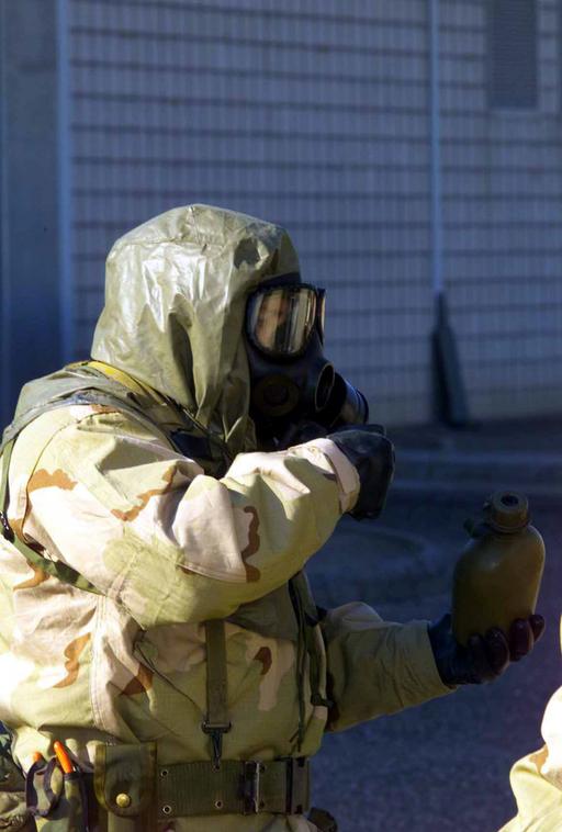 A Marine with Combined Joint Task Force (CJTF) prepares to take a drink ...