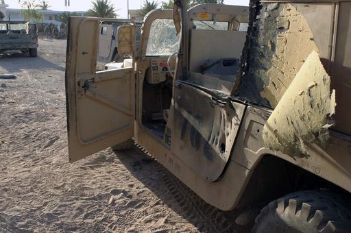 Damage to a US Marine Corps (USMC) M998 High-Mobility Multipurpose ...