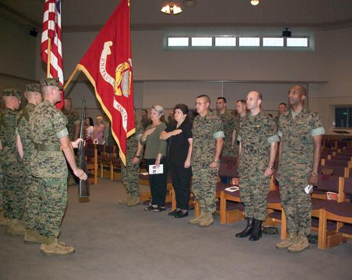 Base personnel, and US Marine Corps (USMC) Marines gather during a ...