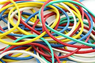 A pile of colored rubber bands on a white surface. Band bands bind,  business finance. - PICRYL - Public Domain Media Search Engine Public  Domain Search
