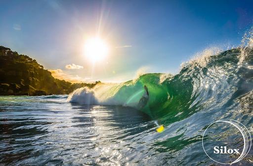 A person riding a wave on top of a surfboard. free photos free images ...