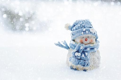 A snowman wearing a blue hat and scarf in the snow.… — PICRYL - Public ...