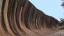 A large wave formation on the side of a rock. Wave rock australia photo contest.