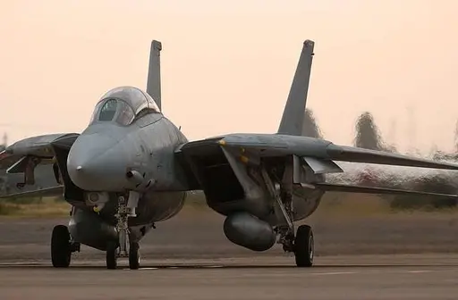 An F-14 Tomcat assigned to the  Black Knights  of Fighter… — PICRYL