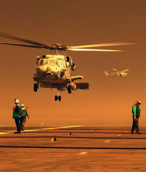An HH-60H Seahawk takes off from the flight deck of USS John C. Stennis ...