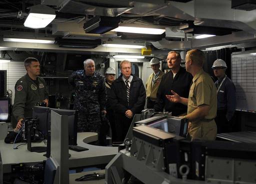 Capt. Kent D. Whalen, right, commanding officer of the aircraft carrier ...