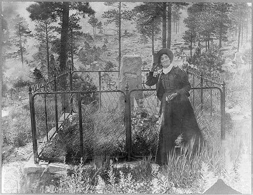 Calamity Jane on Wild Bill's grave — PICRYL - Public Domain Media