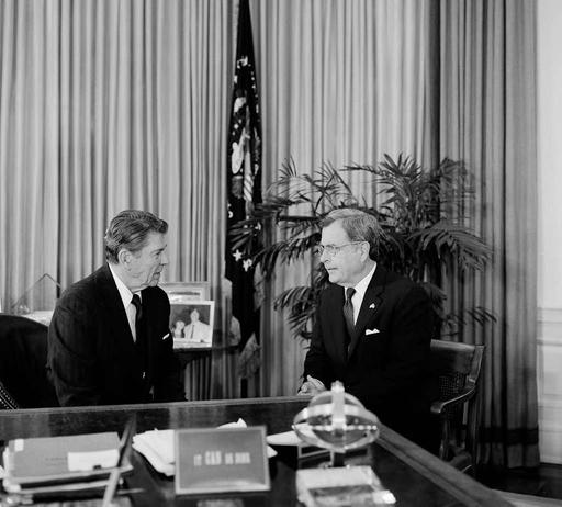 Ronald Reagan at his desk with a Republican Senator in the White House ...