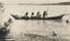 Australian aboriginal family in canoe - circa 1920