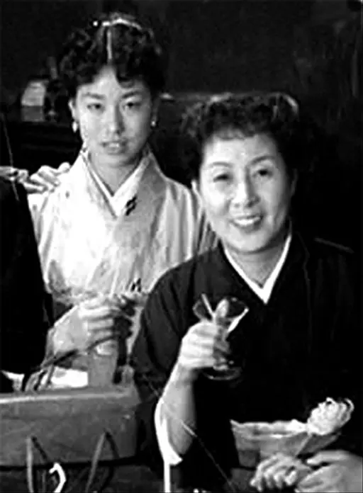 Peko-chan and a war-orphaned child- Ginza 1950 — PICRYL - Public