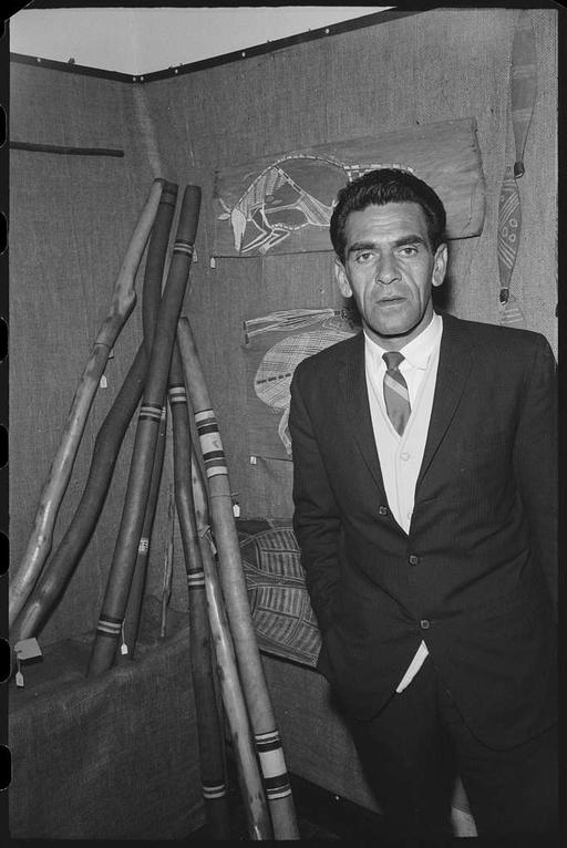 Charles "Chicka" Dixon at the Foundation for Aboriginal Affairs, man, suit, didgeridoo, aboriginal art, musical instrument, cultural display, portrait, exhibition, indigenous culture, traditional art