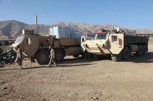 Two heavy-expanded mobility tactical trucks bring supplies - PICRYL ...