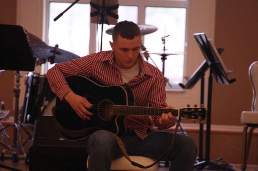 Zach Stephenson plays guitar and sings an original, zach stephenson, guitar, singing, man, music, performance