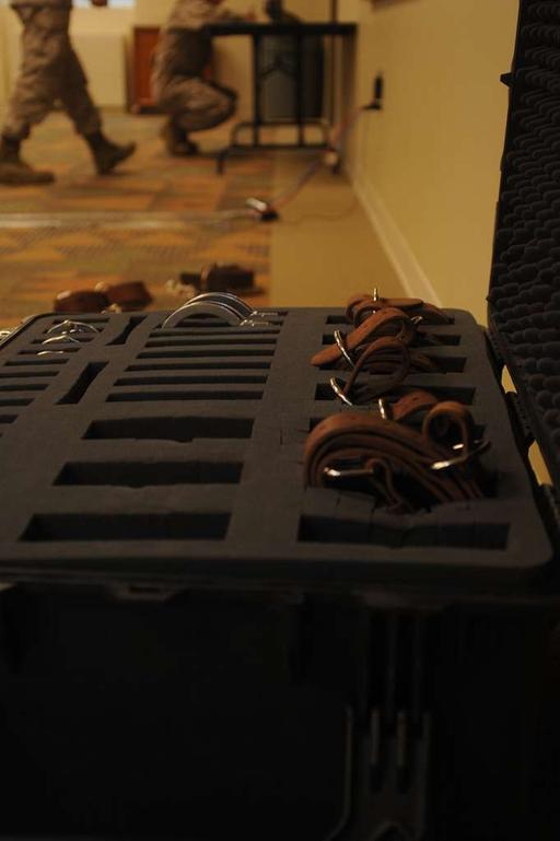 Handcuffs and other restraints are loaded into a container - NARA ...