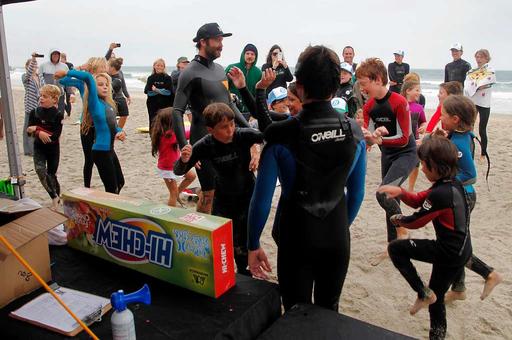 Surfer Mitch Abshere dances with the kids during a — NARA and DVIDS ...