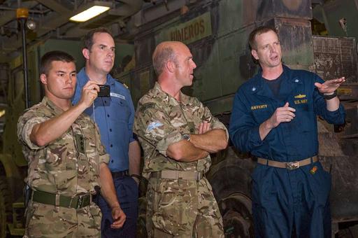 Cmdr. Kevin Rafferty gives a tour to members of the — NARA and DVIDS ...