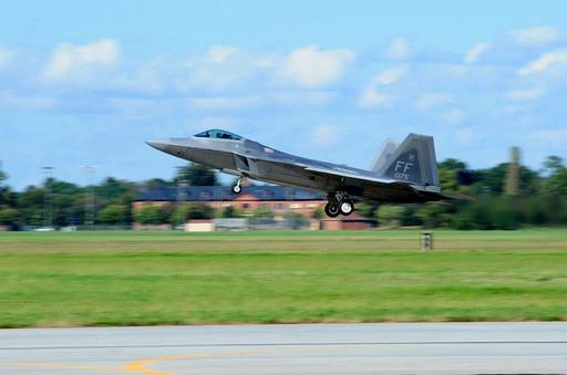 An F-22 Raptor from the 94th Fighter Squadron takes — NARA and