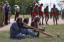 Australian natives, known as Aborigines, play traditional