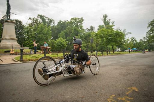 A handcyclist makes his way past the 6 mile point during - PICRYL ...
