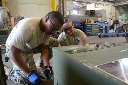 Spc. Jamal Lassiter and Spc. Alyson Turner repair an - NARA ...