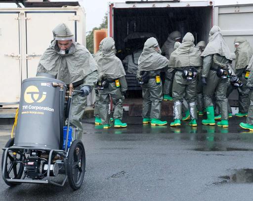 A decon team sets up a decontamination station during — NARA and DVIDS ...
