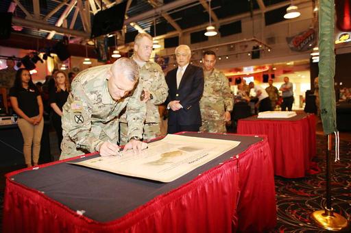 Garrison Commander Col. David J. Pinter Sr. signs the - PICRYL - Public ...