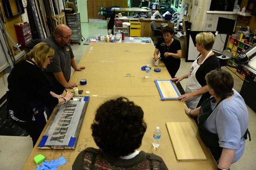 Students construct signs in a (Hammer and Brush) class - NARA & DVIDS ...