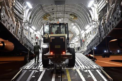 A loadmaster from the 16th Airlift Squadron signals - NARA & DVIDS ...