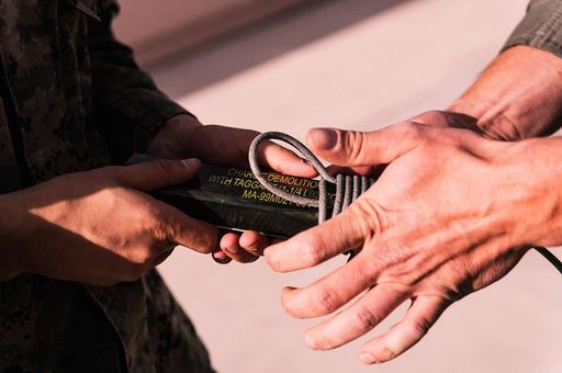 C-4 explosive is wrapped with detonation cord during — NARA and DVIDS ...