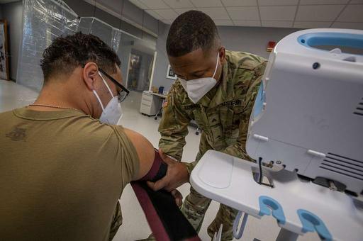 U.S. Army Sgt. Rodari O. Edwards, right, combat medic, — NARA and DVIDS ...