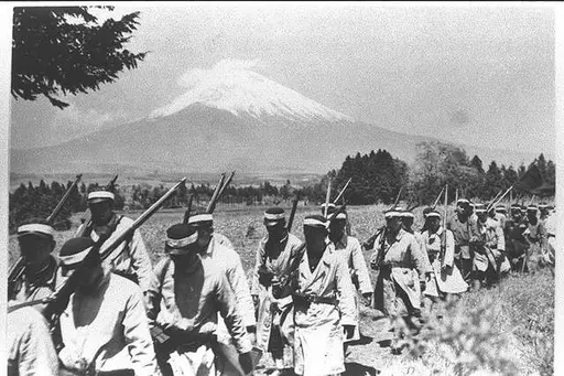 Japanese soldier with flags in December 1937 detail, front