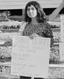 Center protester detail with sign, from- Student Action for Aborigines protest outside Moree Artesian Baths, February 1965 - The Tribune (20821355022) (cropped)