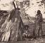 Two Aboriginal woman in front of bark gunya (shelter) wrapped in traditional pelt cloaks, John Hunter Kerr. ca. 1850s