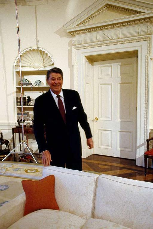 President Ronald Reagan jokes around in the Oval Office of the White ...
