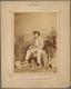 Seated Australian - An old photo of a man and a woman sitting on a bench