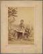 Seated Aboriginal - An old picture of a man with a surfboard